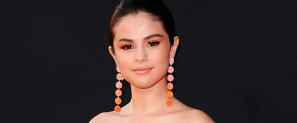 Selena Gomez wearing orange tone makeup